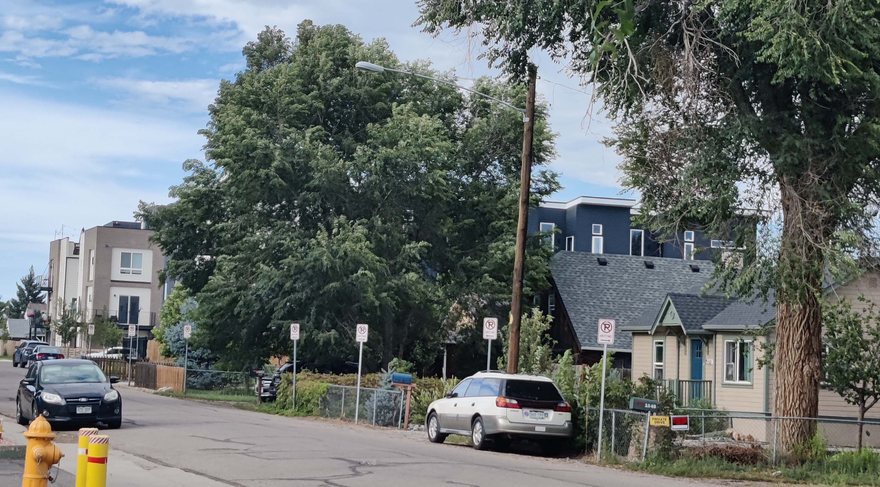 Image of the few houses down Jumbo's street, in between high-density apartments