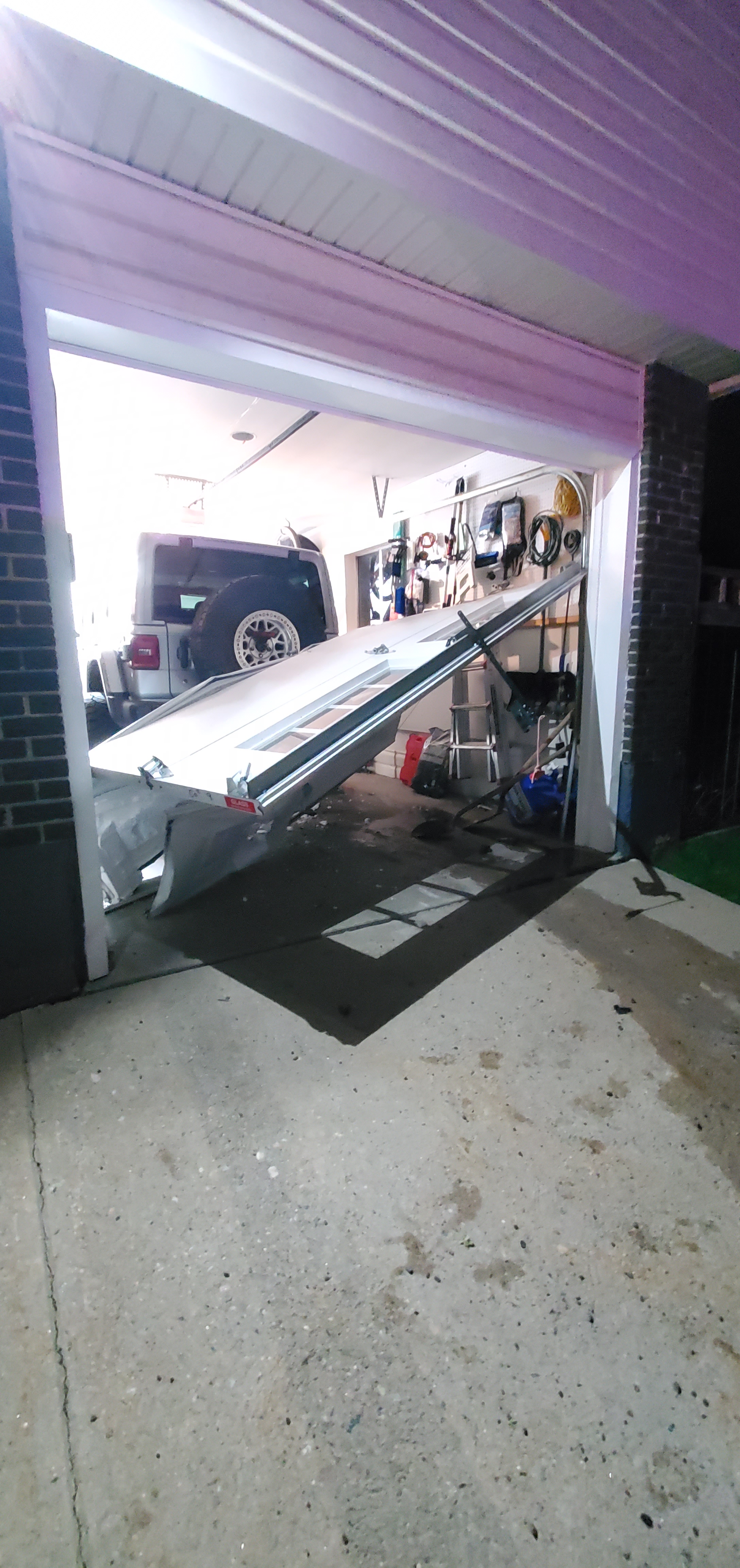 Car goes through the garage